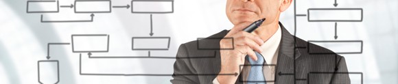 Businessman Studying Flowchart - data analysis and auditing