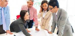 Engineers Converse Over Blueprints - Blueprint and mechanical drawing training